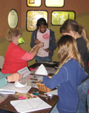 Craft table with volunteers and children