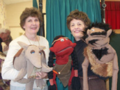 Puppeteers and their puppets